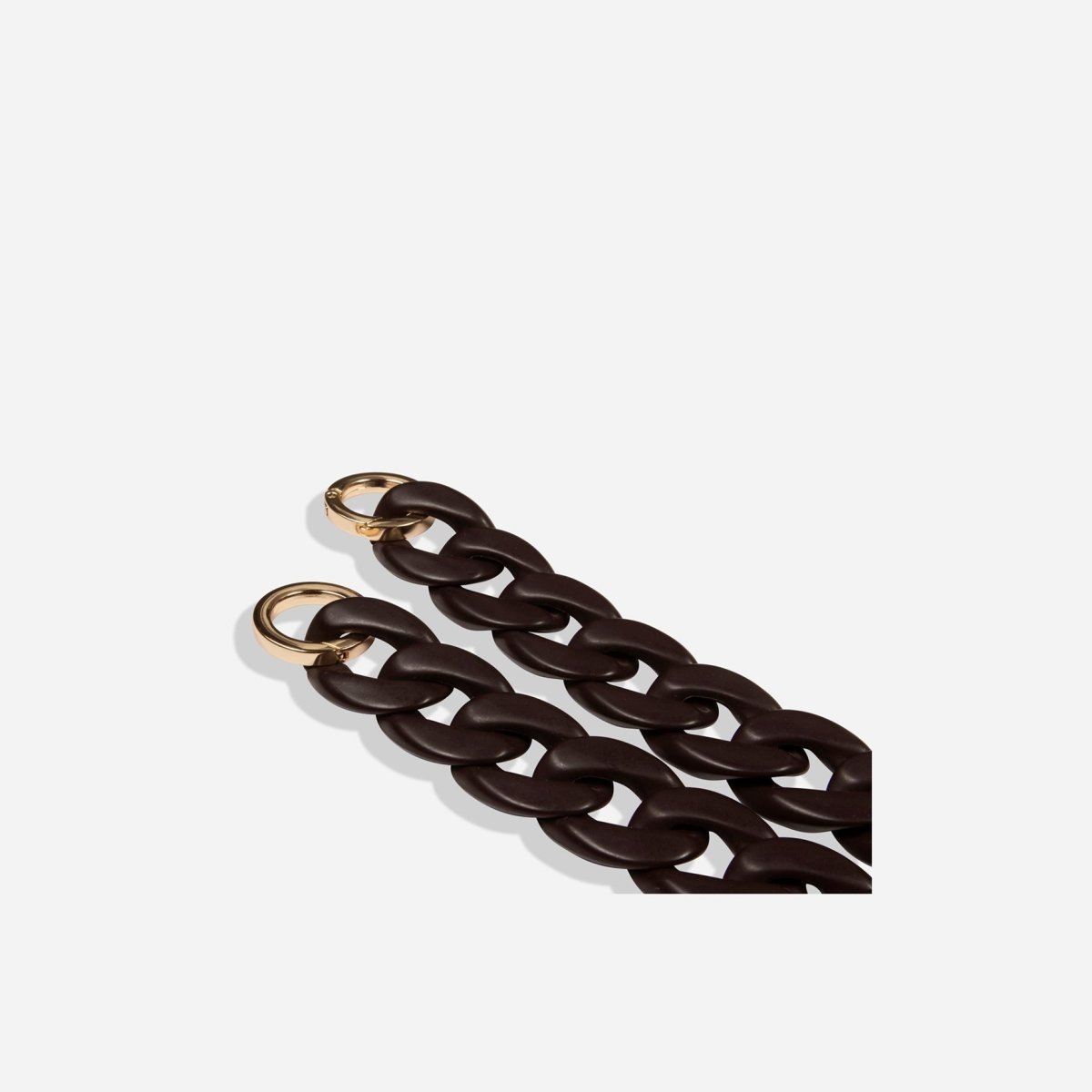 Jekyll and Hide stylish chain strap in brown, designed to complement handbags with a sleek and elegant finish, closeup image