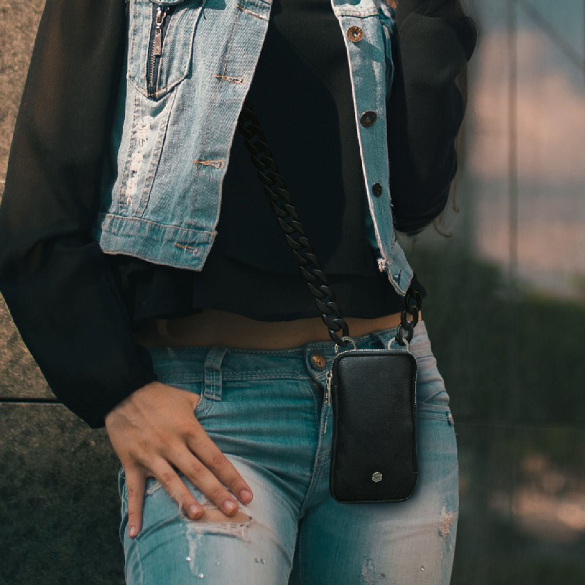 Jekyll and Hide stylish chain strap in black, designed to complement handbags with a sleek and elegant finish, lifestyle image