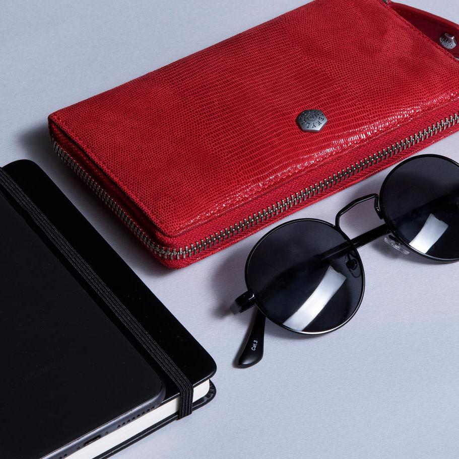 Jekyll and Hide medium zip around purse in cherry leather, with card slots and a secure zip closure, lifestyle image