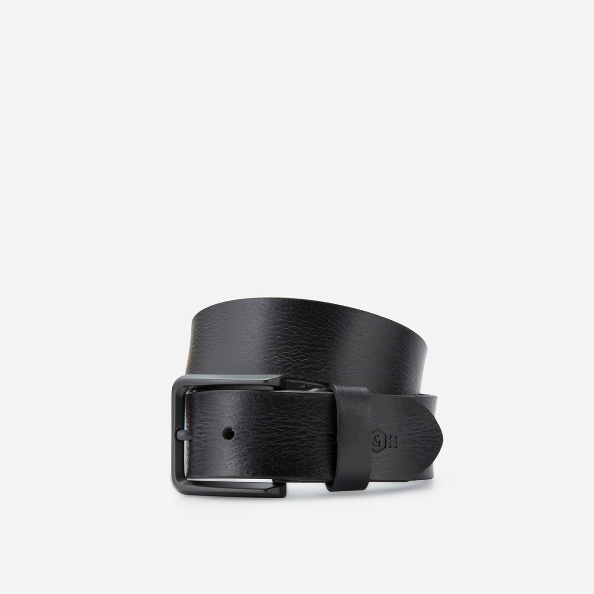 Black leather Lyon belt rolled, showing the buckle and debossed logo, Jekyll & Hide