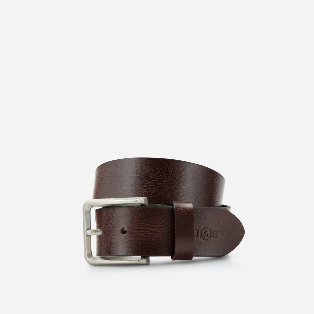 Brown leather Lyon belt rolled, showing the buckle and debossed logo, Jekyll & Hide