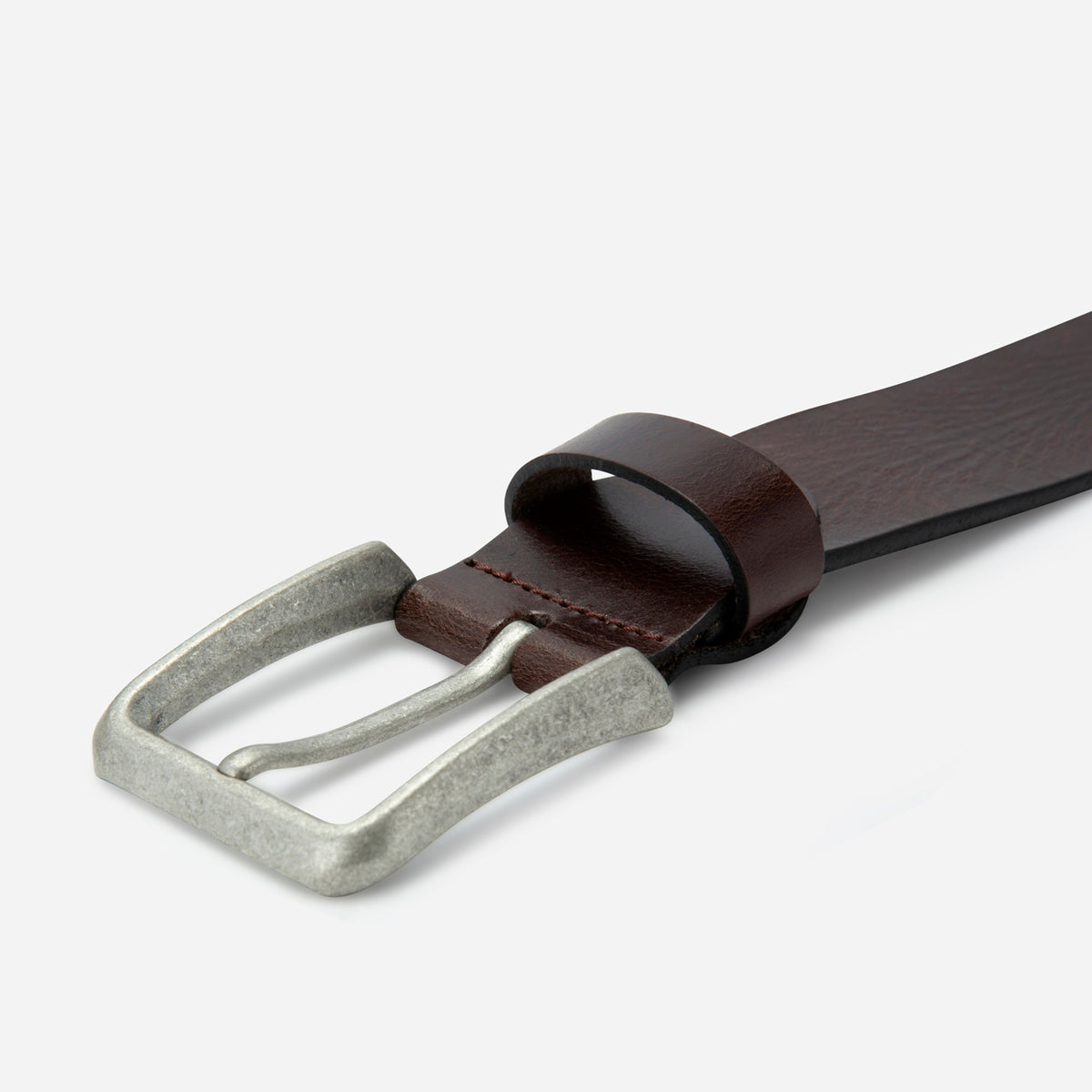 Old silver buckle on the brown leather Lyon belt, close-up, Jekyll & Hide