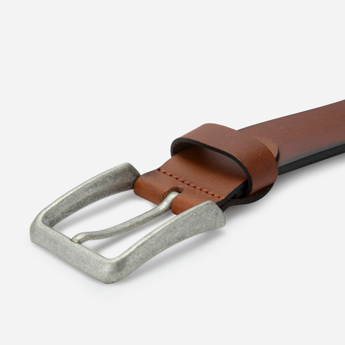 Old silver buckle on the tan leather Lyon belt, close-up, Jekyll & Hide