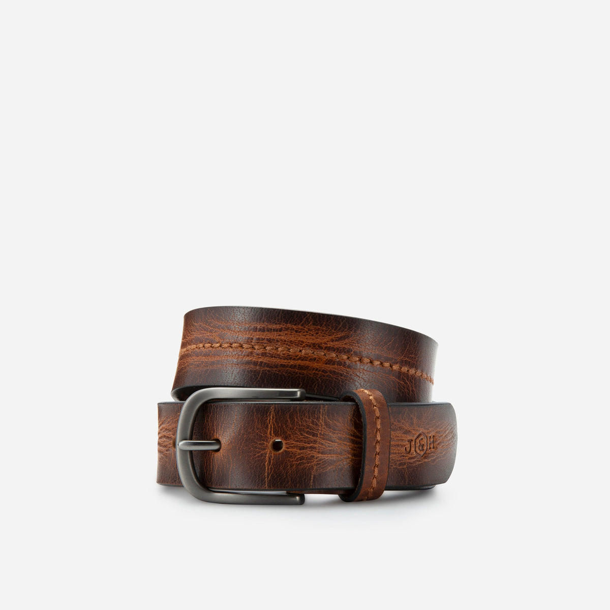Tan leather Bordeaux belt rolled, showing the stitched centre line and debossed logo, Jekyll & Hide
