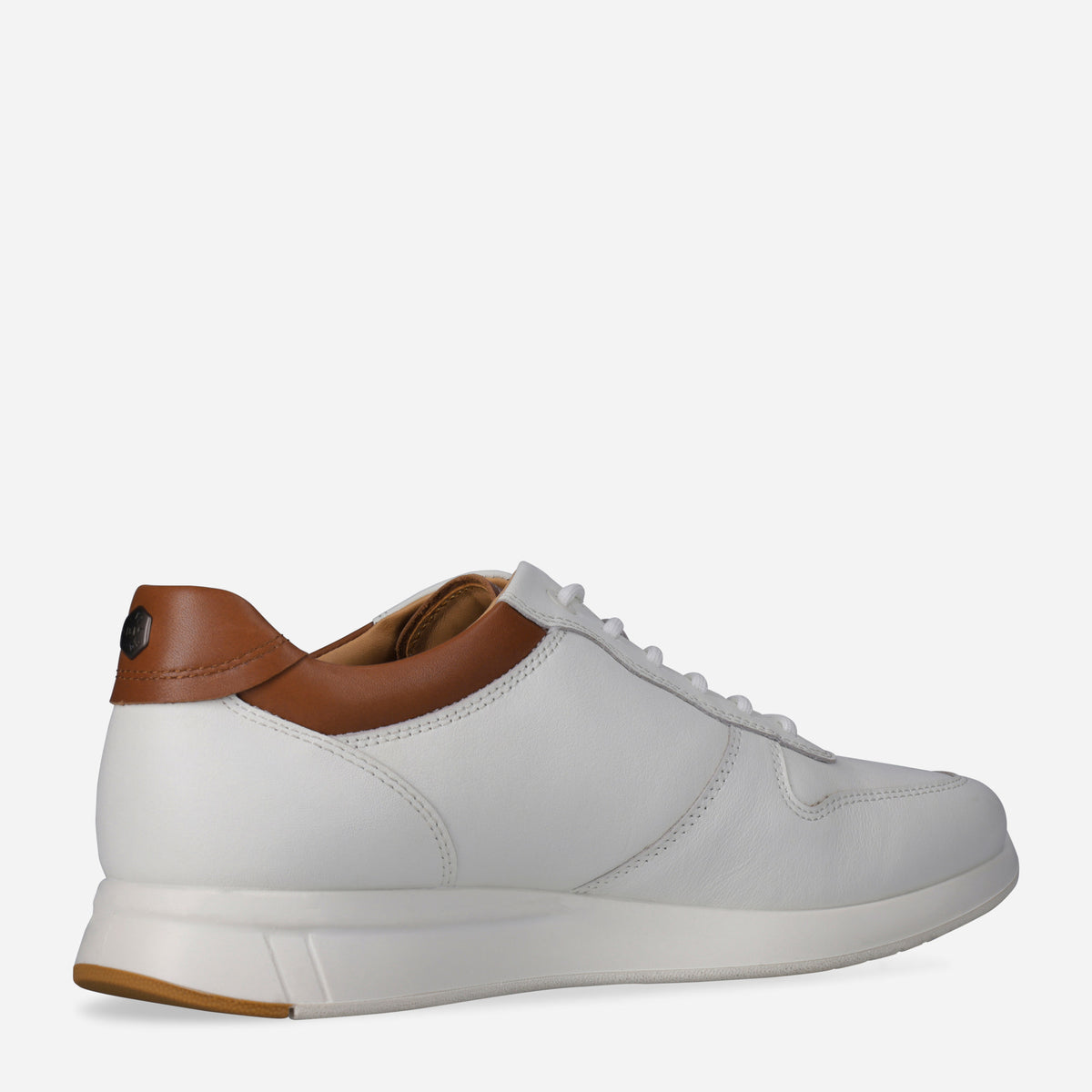Rear three-quarter view of the white Franca Sneaker with tan heel and logo stud