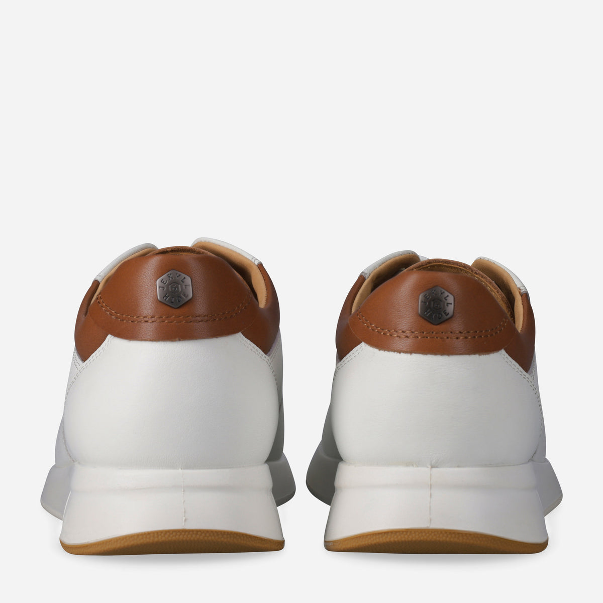 Heels of the white Franca Sneakers with tan leather heel panels and logo studs