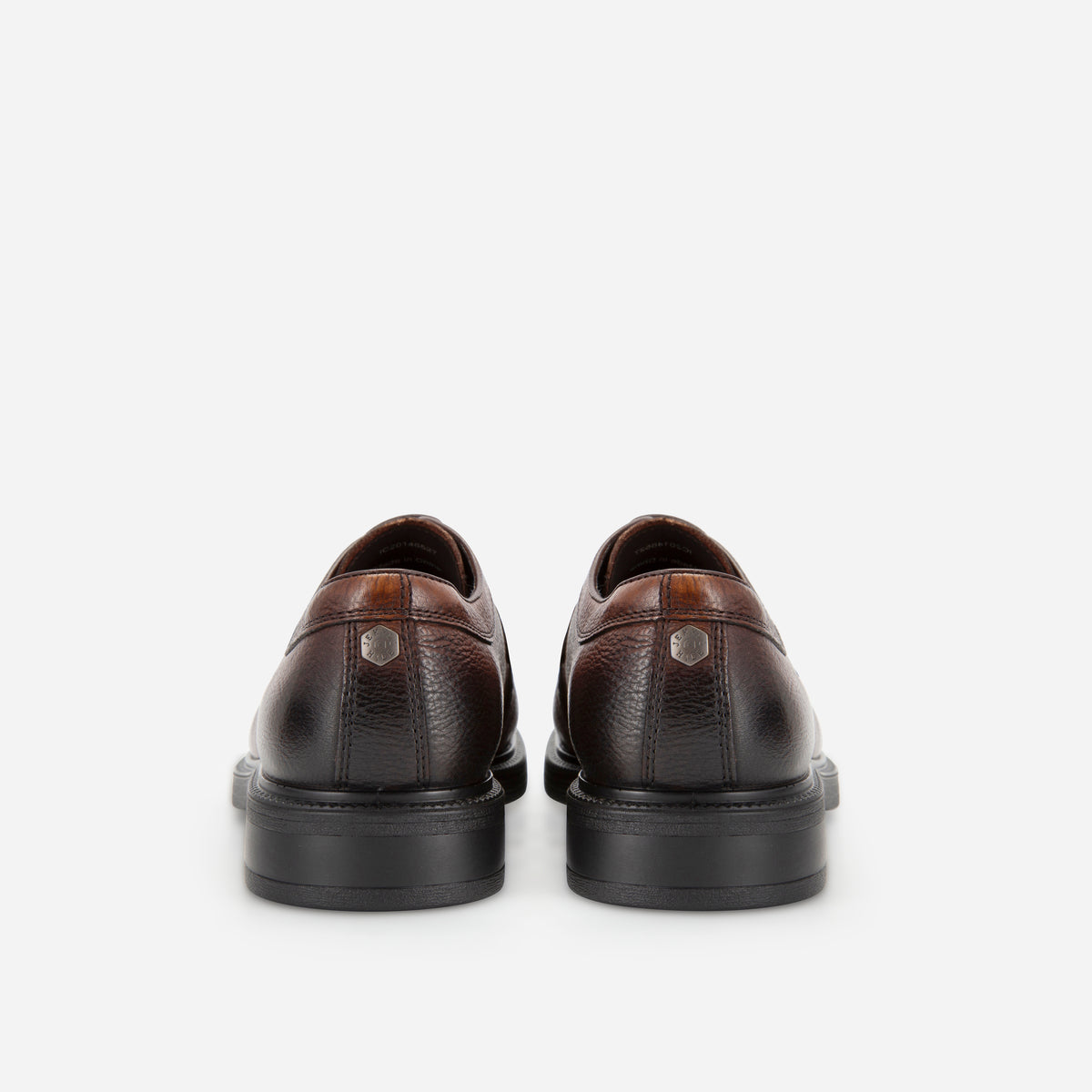 Heels of the brown Oxford Derby Shoes with embossed logo