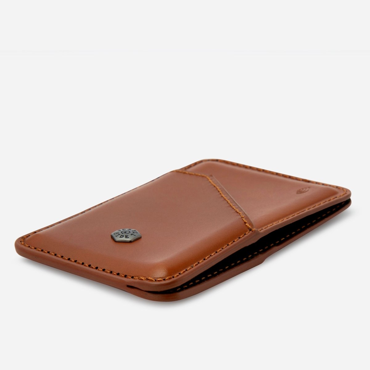Brown leather wallet on a light gray background