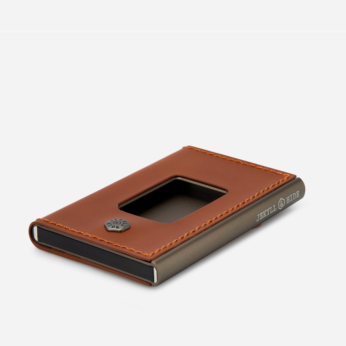 Brown leather cardholder with visible brand name on a light gray background