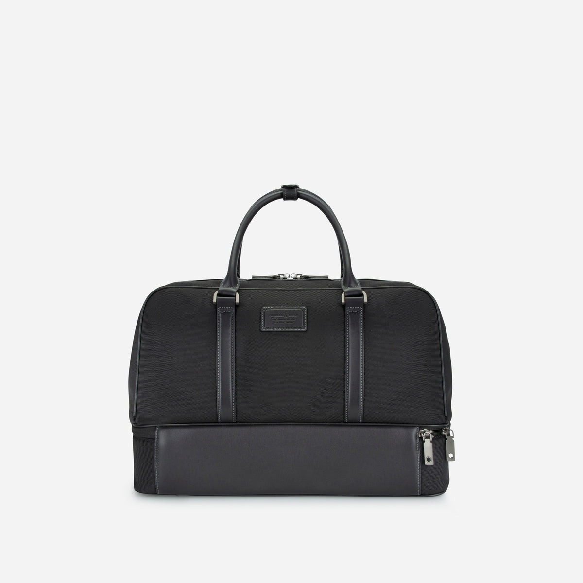Back of the black Tokyo golf duffle, showing the leather patch and lower compartment zip, Jekyll & Hide