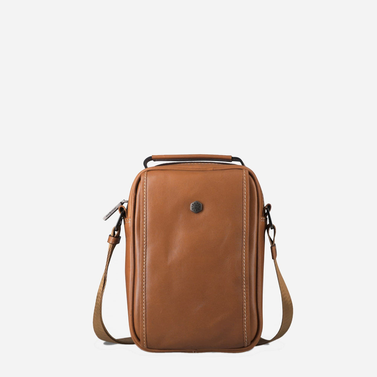 A brown leather crossbody bag with a top handle, adjustable shoulder strap, and a small round metal button on the front, shown against a plain white background.