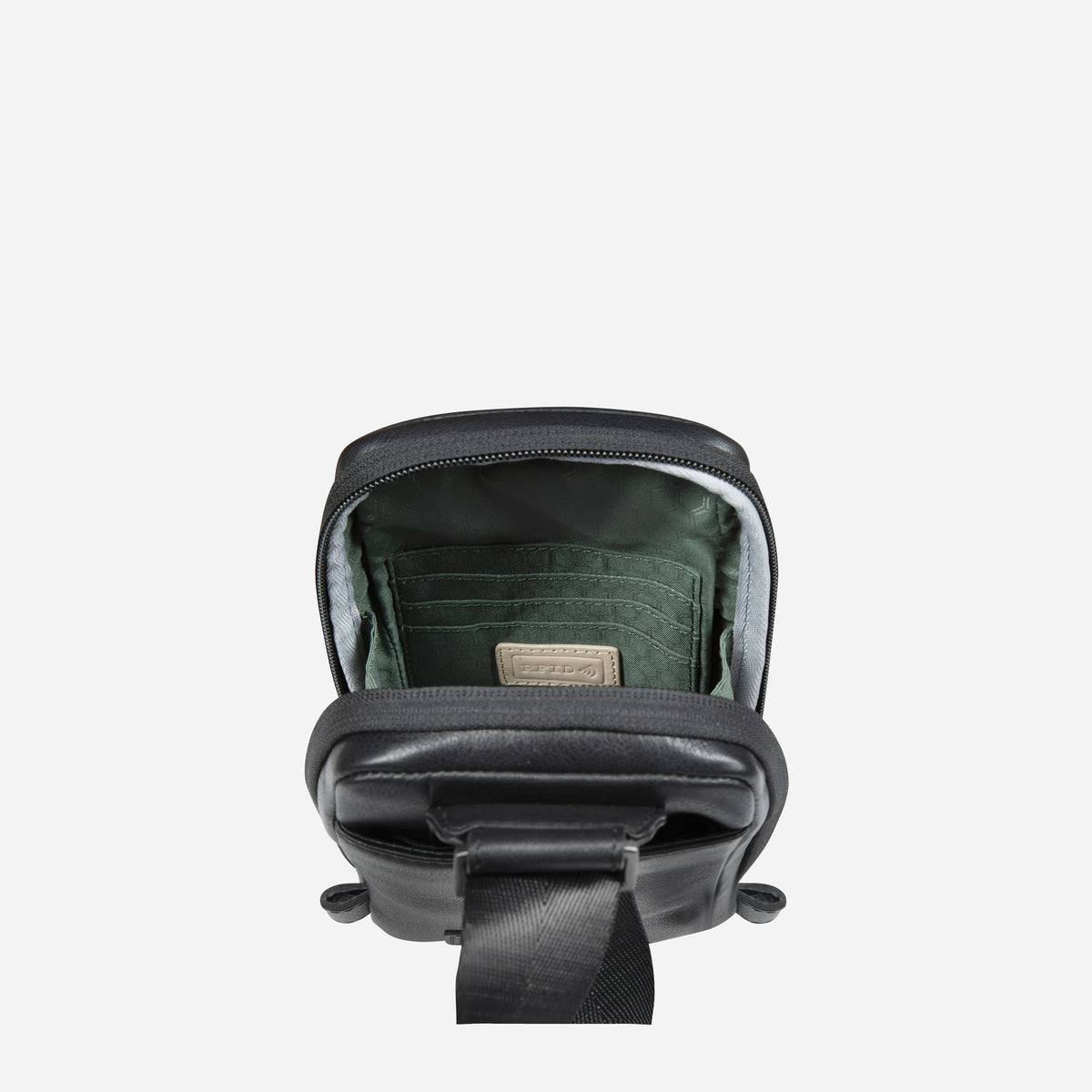 Black Compact Crossbody open from above, showing the green lined pockets