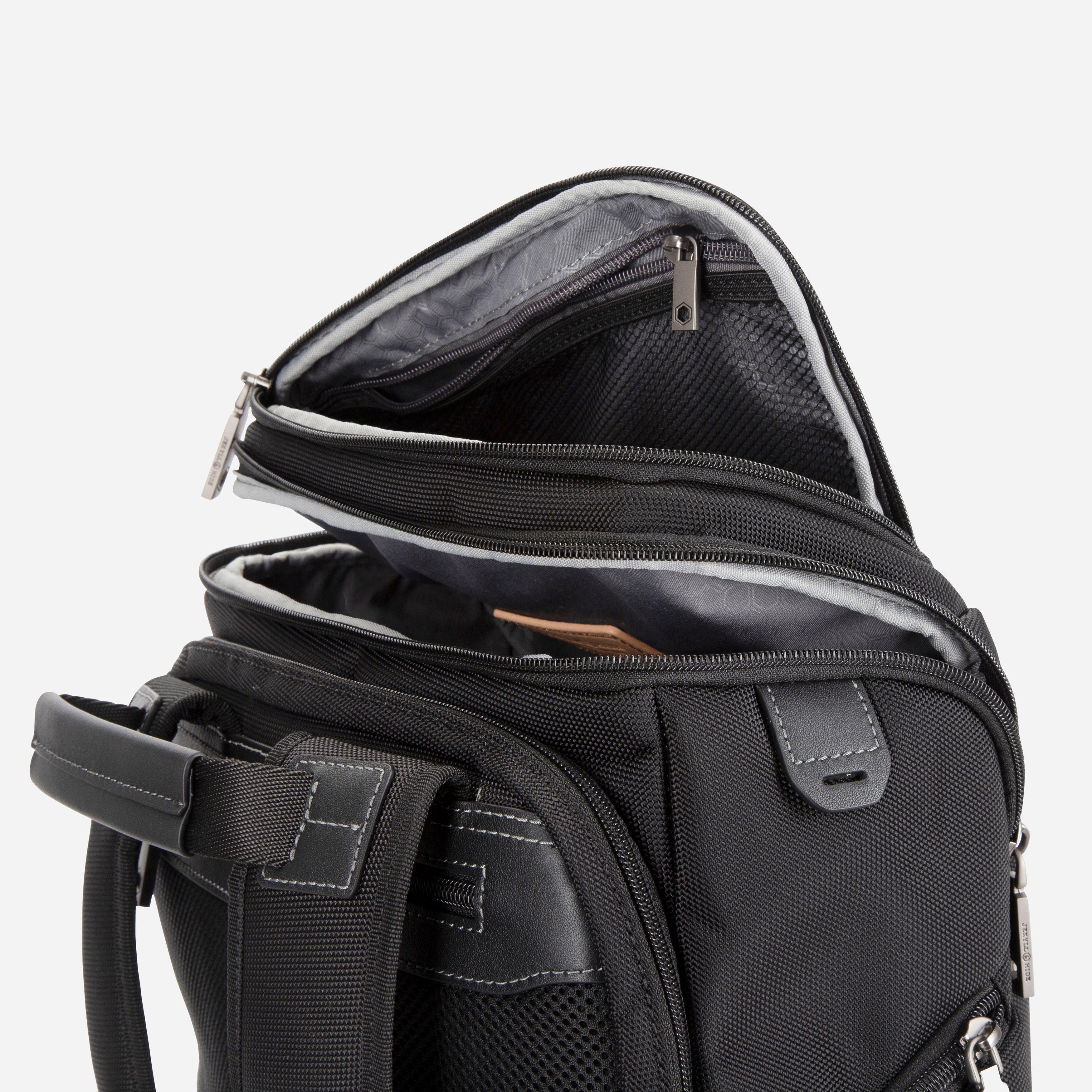 Jekyll & Hide Tokyo Flip-Top Backpack in Black, lid open showing the zipped mesh pocket inside