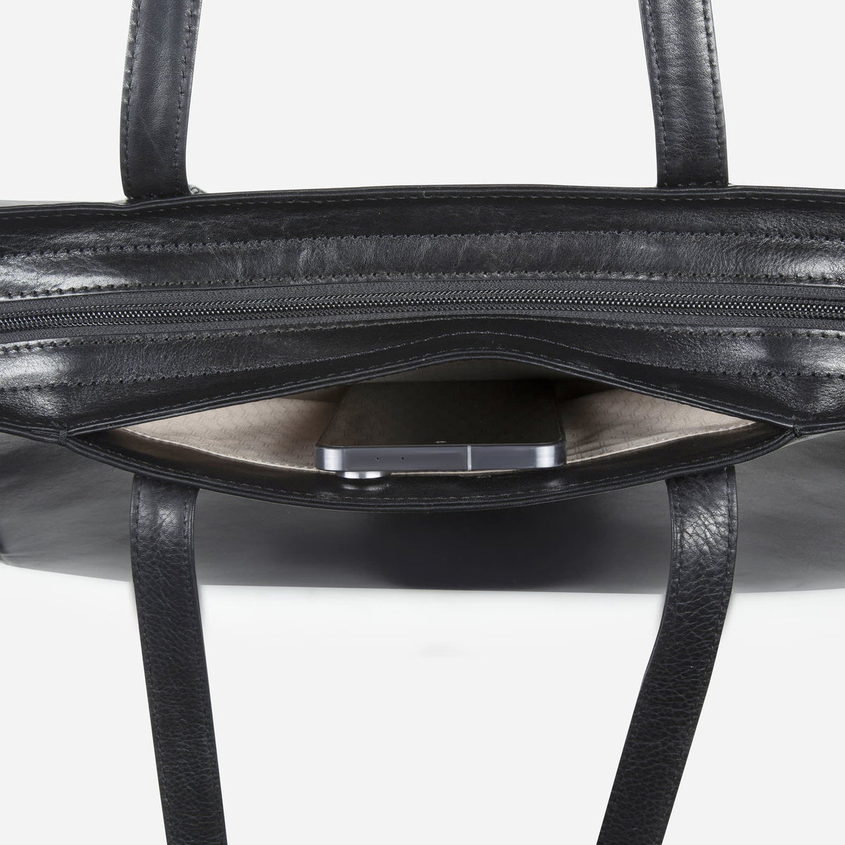 Interior of the black Paris Shopper with a device in the padded laptop compartment