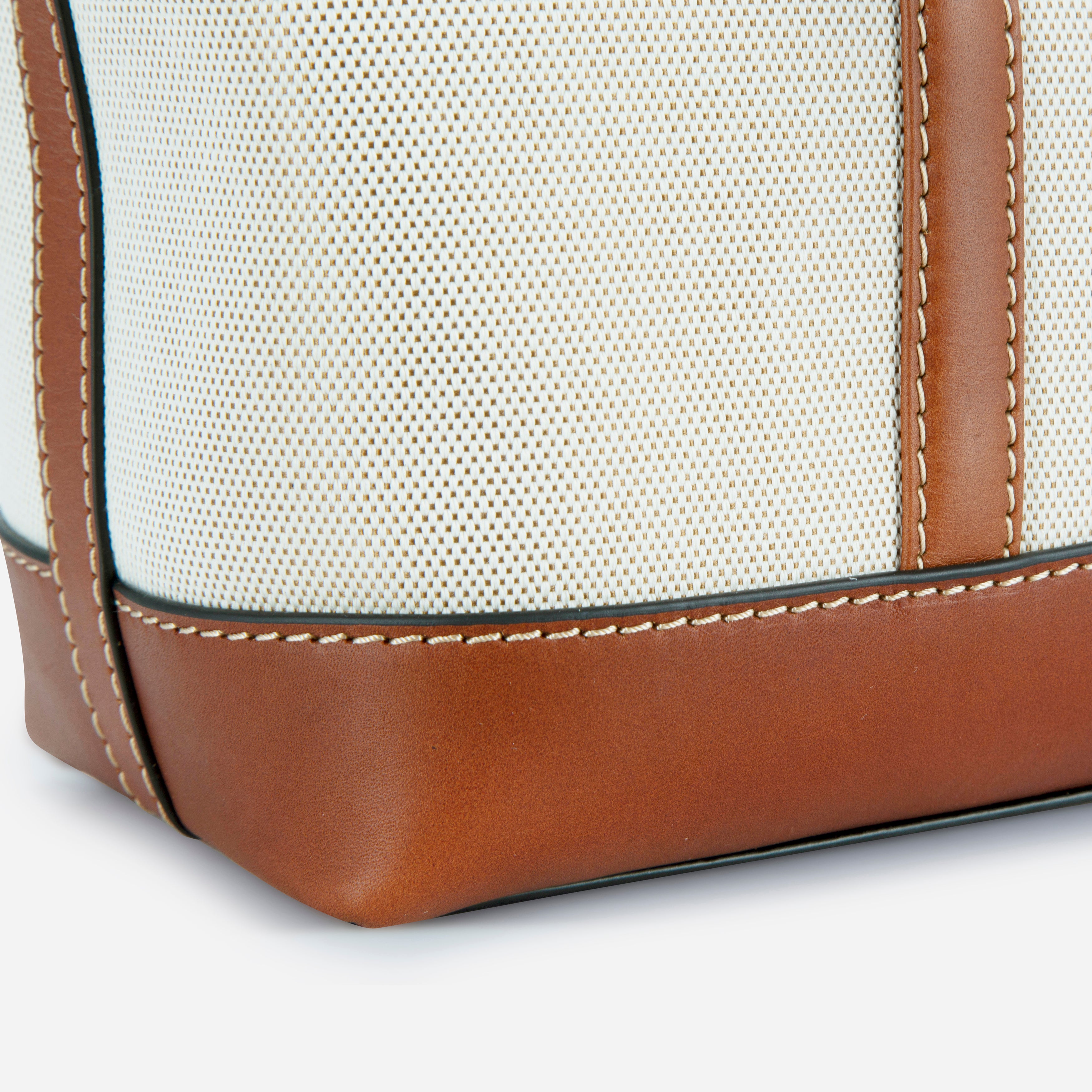 Jekyll & Hide Canvas Shopper Tote in Colt, close-up of the leather corner panel and contrast saddle stitching
