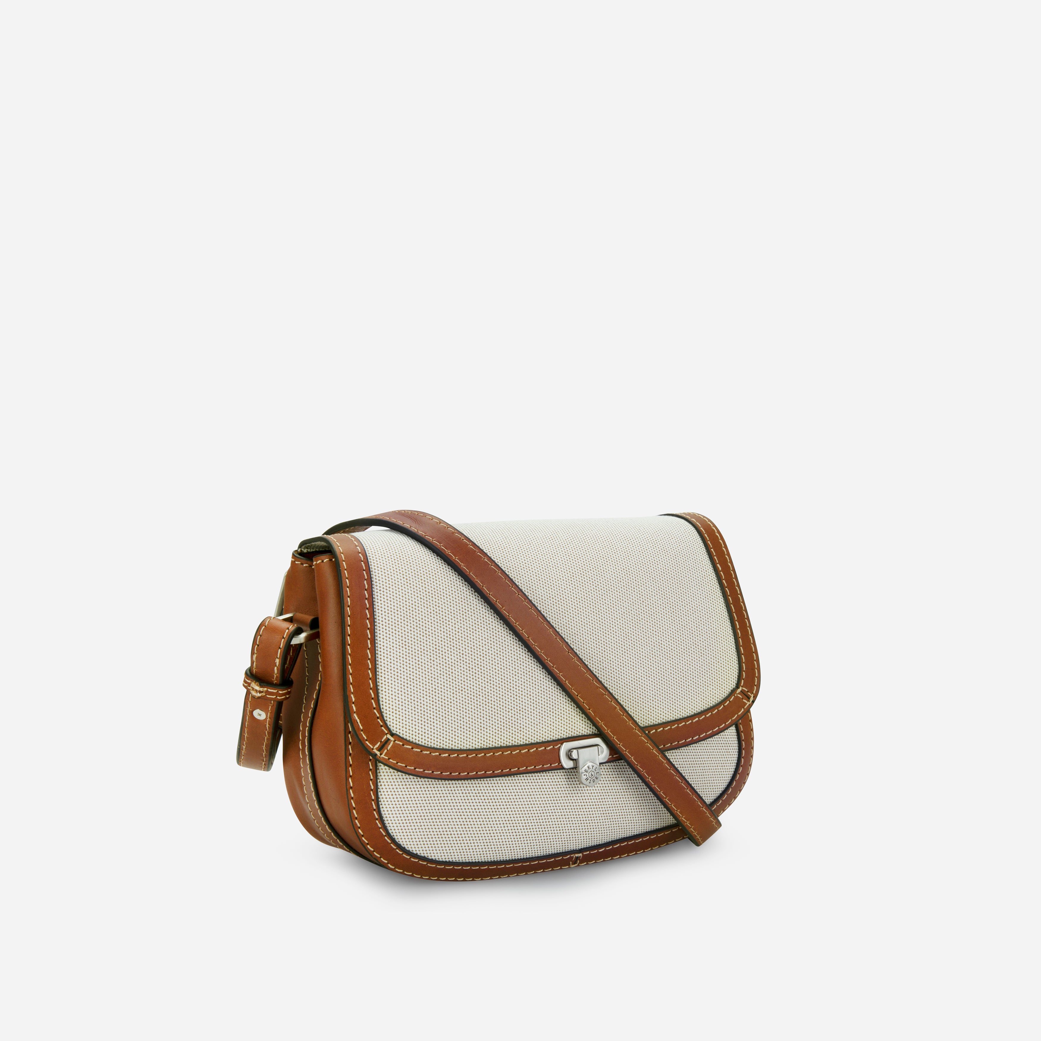 Jekyll & Hide Canvas Crossbody Saddle Bag in Colt, three-quarter side view showing the adjustable strap
