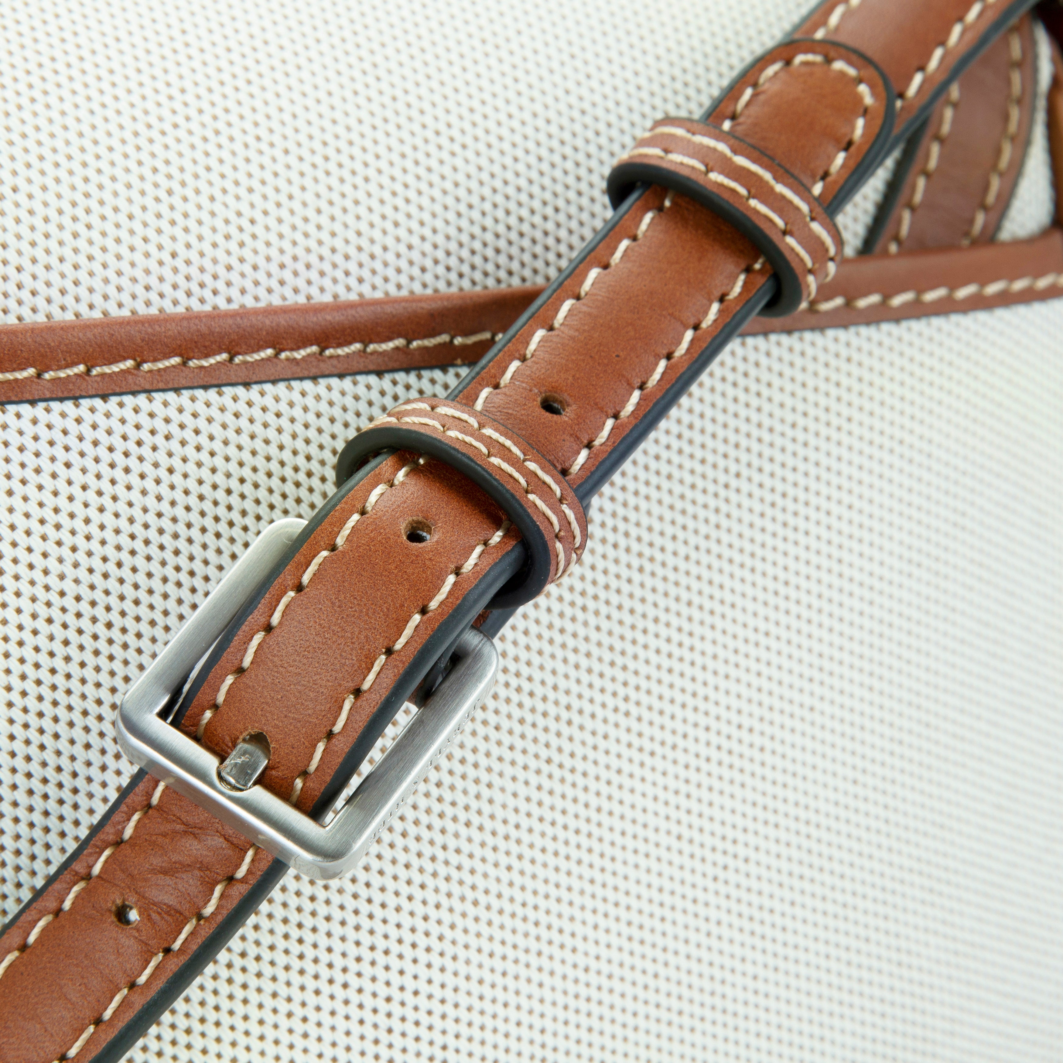 Jekyll & Hide Canvas Crossbody Saddle Bag in Colt, close-up of the strap buckle and contrast saddle stitching