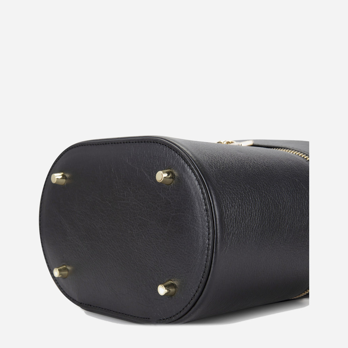 Base of the black Geneva Vanity Case with gold-tone protective feet