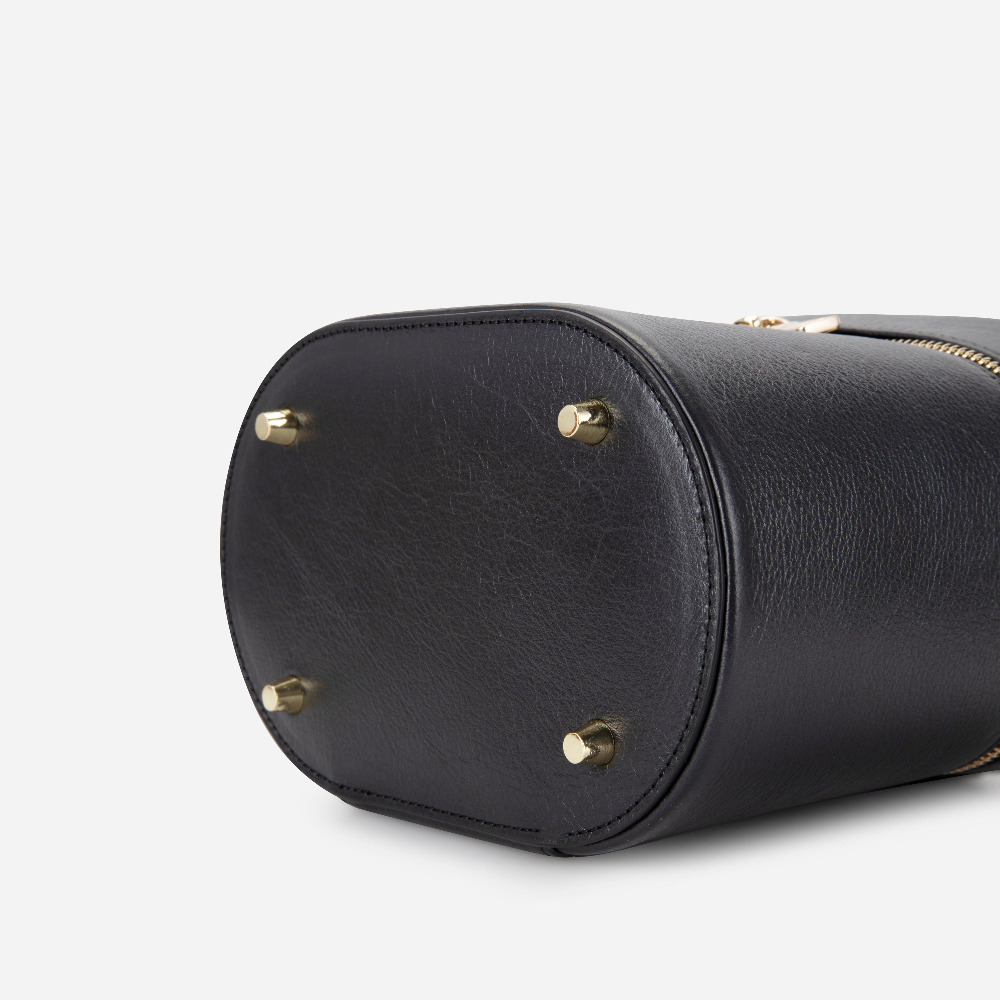 Jekyll & Hide Geneva Vanity Case in Black, underside showing the four gold-tone metal feet