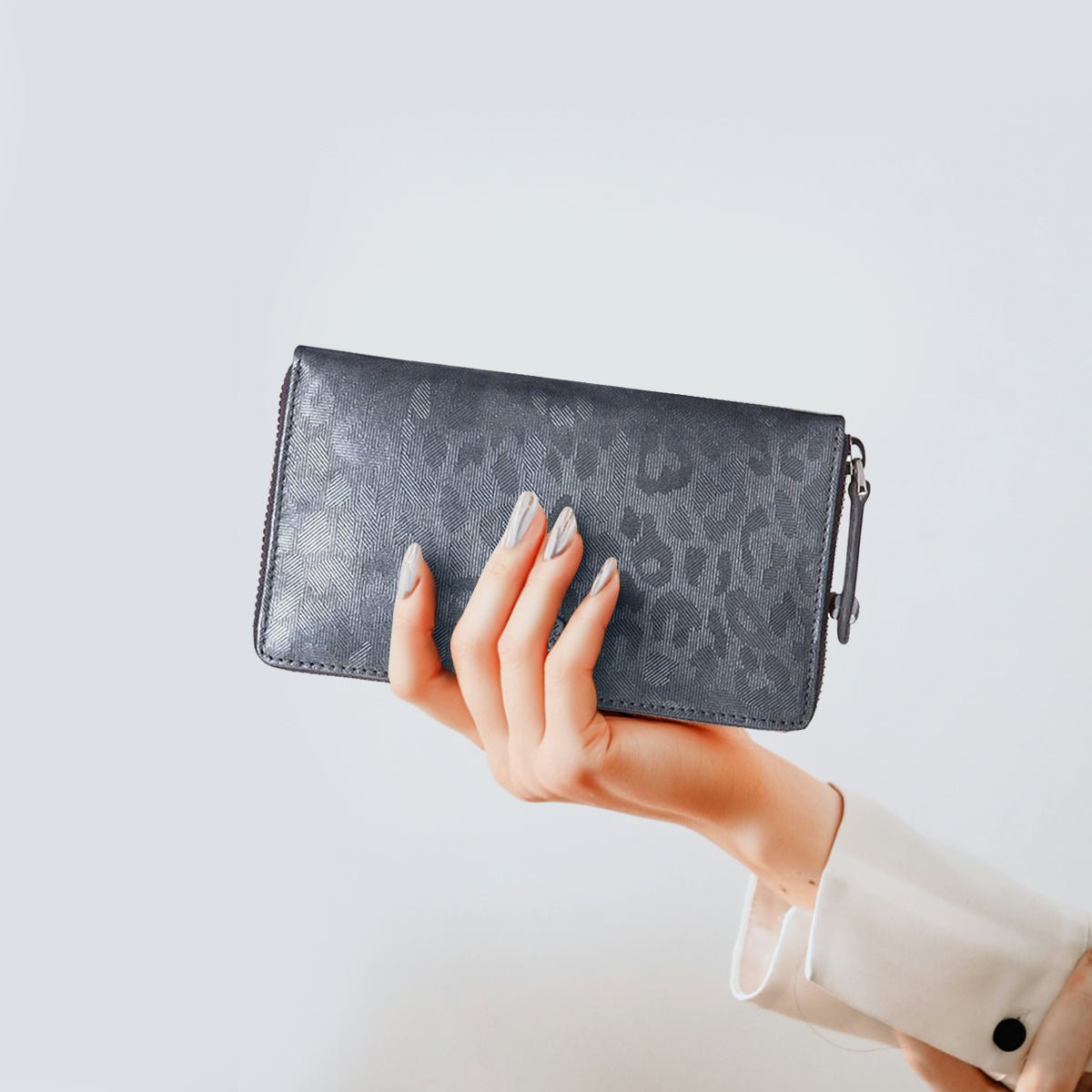 Jekyll and Hide medium zip around purse in shimmer leather, with card slots and a secure zip closure, lifestyle image